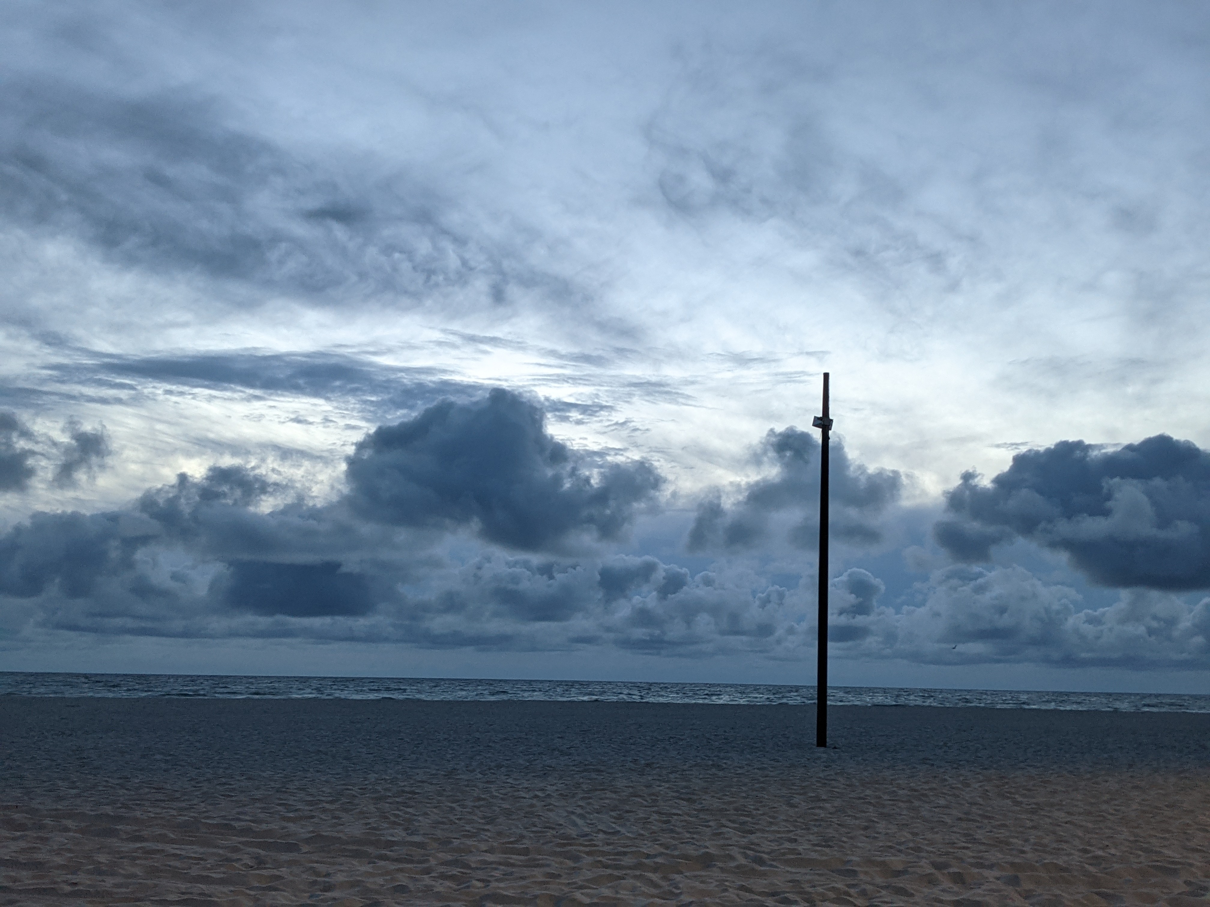 striking gray clouds on the beach