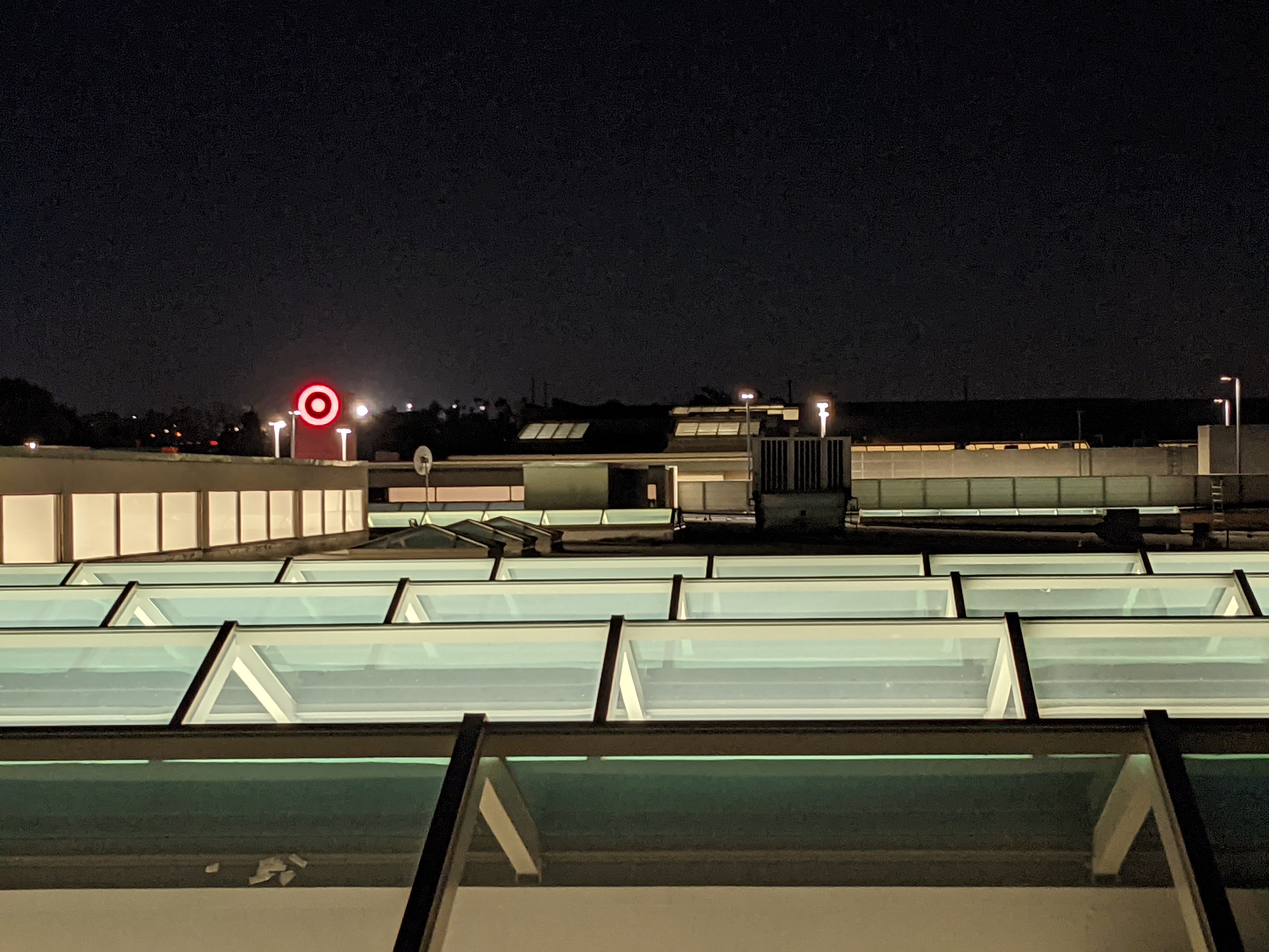 mall roof with evil Target logo glowing in the background